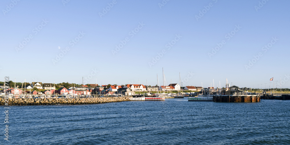 Laesoe / Denmark: View from the outer breakwater of the ferry port basin to the entrance of the fishing port and the marina in Vesteroe Havn