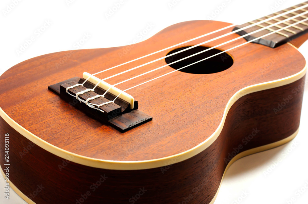 Fototapeta premium ukulele, brown on a white background.