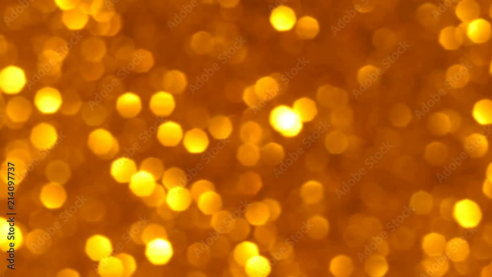 Golden Blaze of Sparkles and Bokeh. A riot of gold bokeh, glitter and sparkles - real, not CGI. A magical effect. Seamless loop. Golden Blaze of Sparkles and Bokeh. A riot of gold bokeh, glitter and sparkles - real, not CGI. A magical effect. Seamless loop.