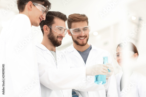 group of scientists working with chemicals