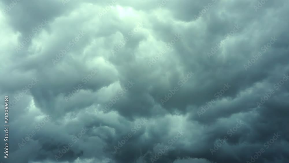 Rain clouds moving slow with flash of lightning on the left side. View of the lightning in storm clouds.. Rain clouds moving slow with flash of lightning on the left side. View of the lightning in storm clouds..