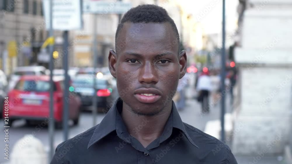 Proud american african man staring at camera in the street Proud american african man staring at camera in the street