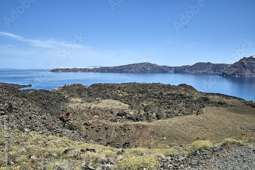 Greece. Santorini. The island of Nea Kameni. View of the island of Thire and the town of Oia photo