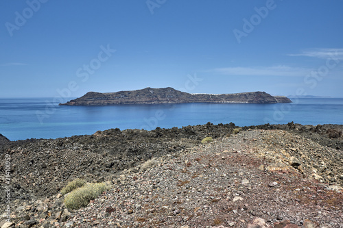 Greece. Santorini. The island of Nea Kameni. View of the island of Thirasia photo