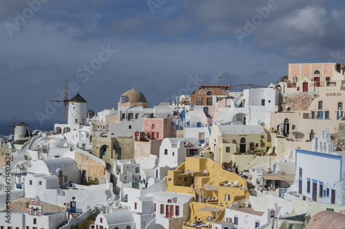 Whitewashed Houses and Windmill on Cliffs with Sea View in Oia, Santorini, Cyclades, Greece © MilesAstray