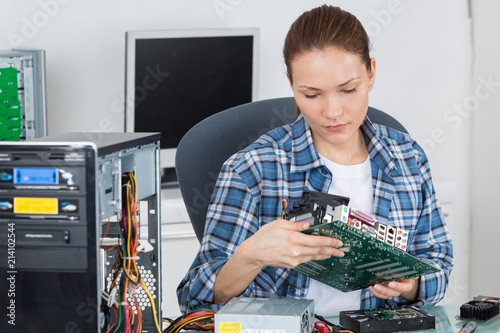 Woman holding computer component