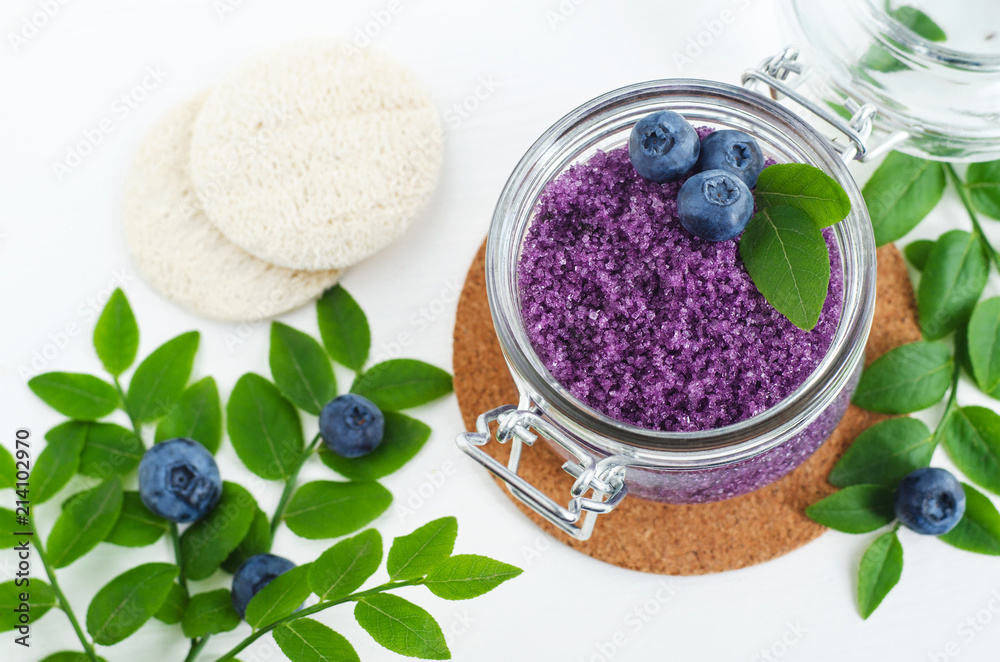 Homemade blueberry sugar scrub/bath salts/foot soak in a glass jar. DIY cosmetics for natural skin care. Top view, copy space. Homemade blueberry sugar scrub/bath salts/foot soak in a glass jar. DIY cosmetics for natural skin care. Top view, copy space.