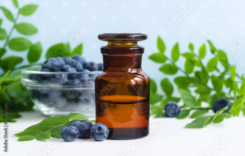 Pharmacy bottle with blueberry extract (tincture, infusion, oil). Copy space.  photo