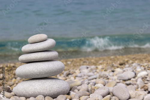 Grey pebbles: stone cairn tower, poise stones,  zen sculpture.