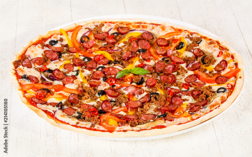 Pizza with sausages and minced meat Pizza with sausages and minced meat