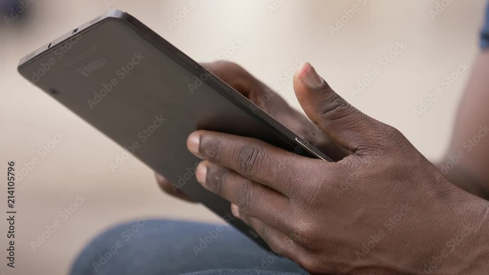 comunication, modernity, life- black man's hands using digital tablet- outdoor comunication, modernity, life- black man's hands using digital tablet- outdoor