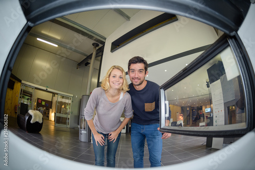 Fisheye view of couple from inside a woodburner