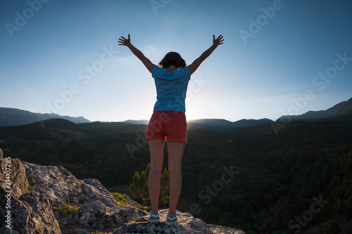 Girl at the top of the mountain.