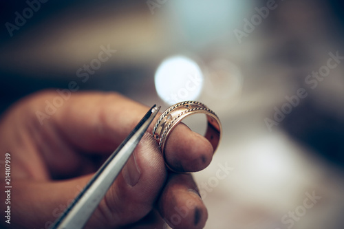 Fényképezés Different goldsmiths tools on the jewelry workplace