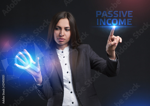 The concept of business, technology, the Internet and the network. A young entrepreneur working on a virtual screen of the future and sees the inscription: Passive income