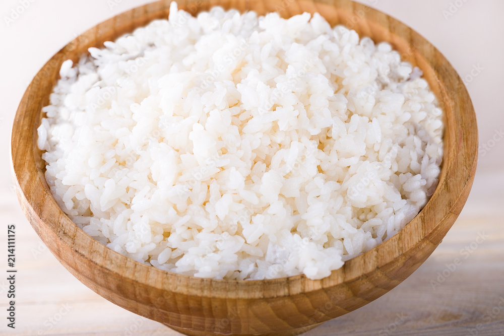 Steamed white rice in wooden bowl on wooden table , Thailand, China,Japan food. Steamed white rice in wooden bowl on wooden table , Thailand, China,Japan food.