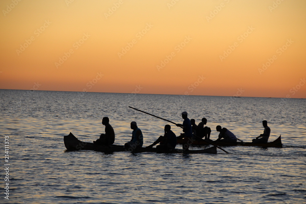 Fishermen on sunset in the sea