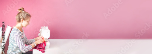 Fashion Design Sewing Machine Concept. Dressmaker woman working with sewing machine.