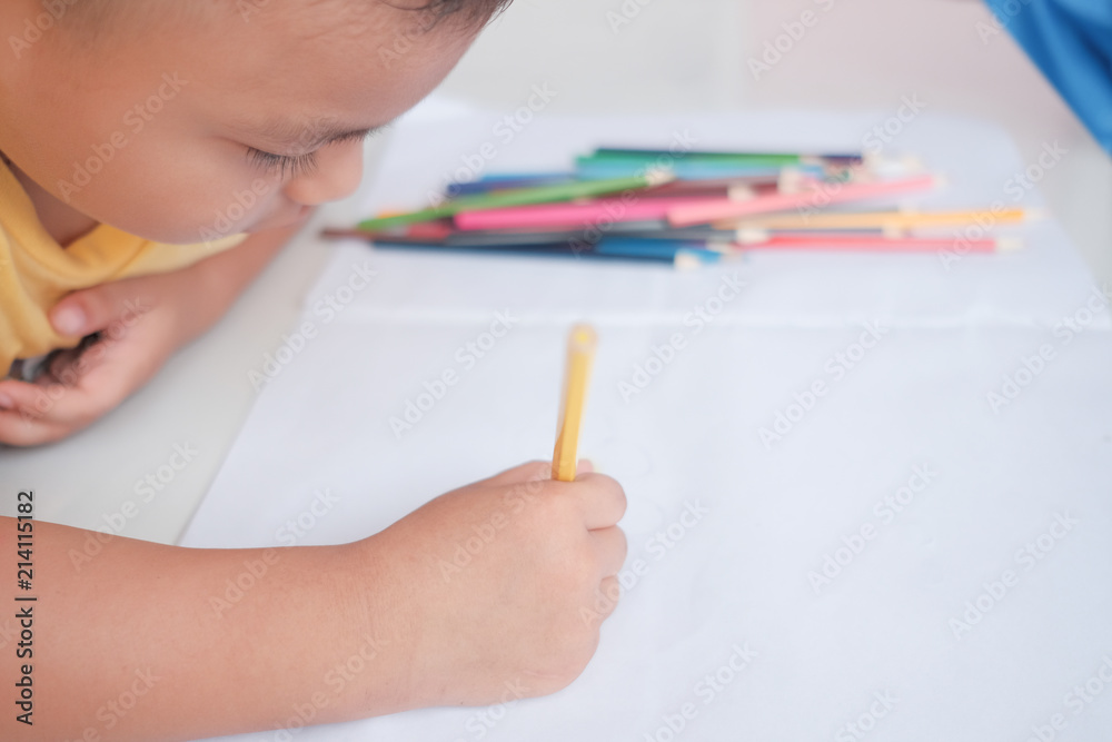 The boys are practicing drawing and coloring. The boys are practicing drawing and coloring.