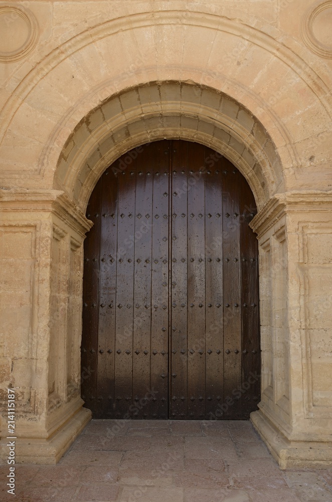 Wooden door of Church in Antequera, Andalusia, Spain