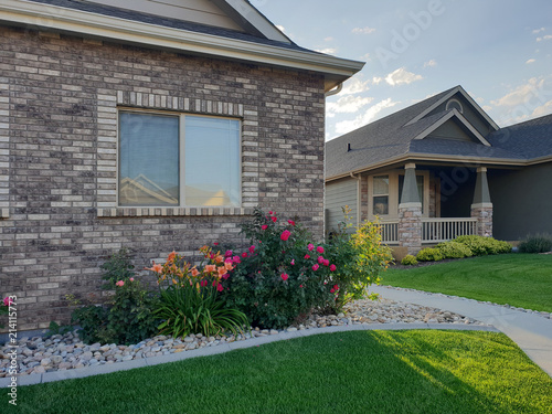 Flowers in Front of Brick Home