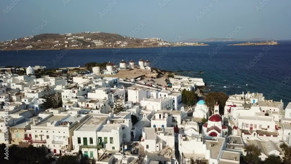 Aerial drone, bird's eye view video of iconic windmills in Chora of Mykonos island, next to little Venice, Cyclades, Greece Aerial drone, bird's eye view video of iconic windmills in Chora of Mykonos island, next to little Venice, Cyclades, Greece