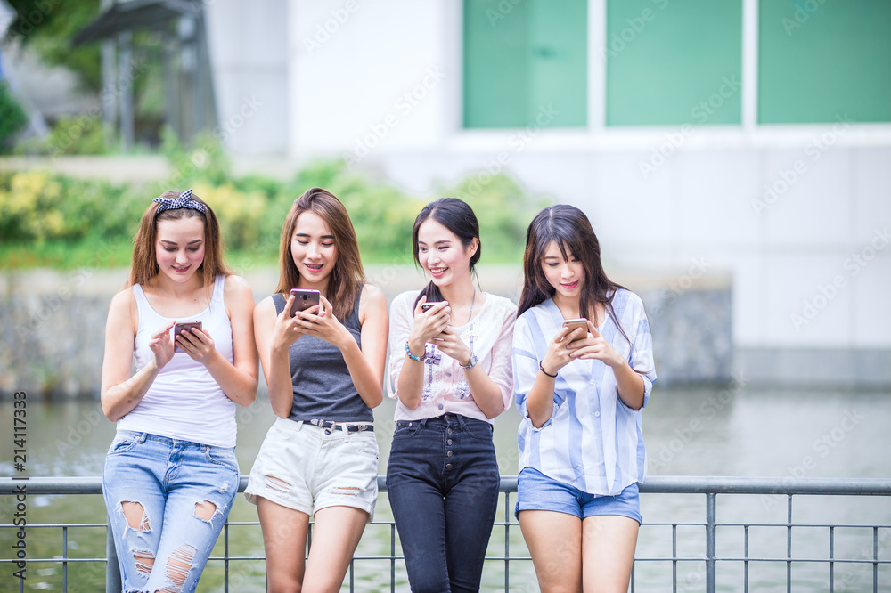 beautiful young group woman using there mobile phone beautiful young group woman using there mobile phone