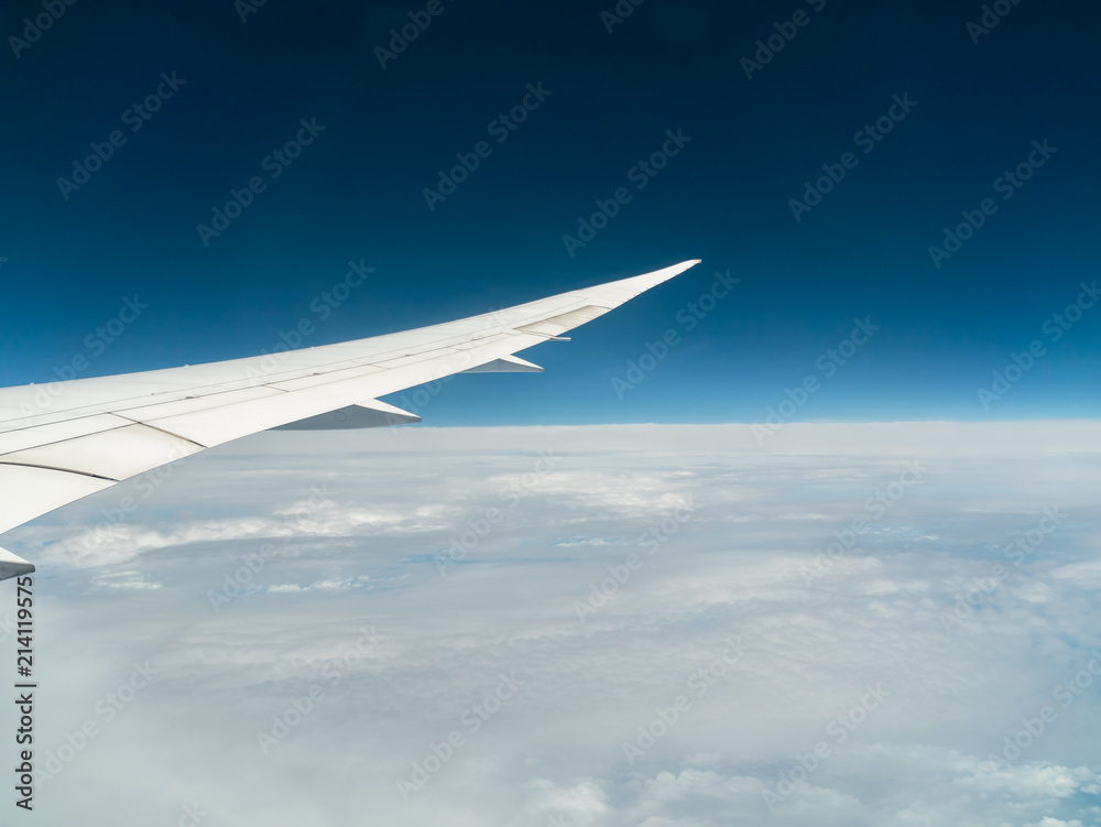 View from airplane window with blue sky and white clouds, background for travel holiday trip, Aircraft on the sky. View from airplane window with blue sky and white clouds, background for travel holiday trip, Aircraft on the sky.