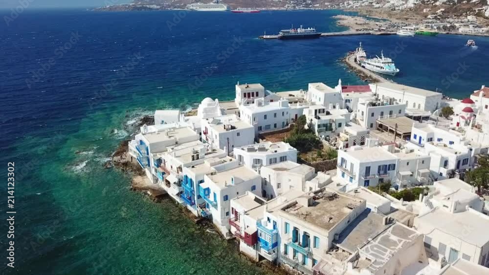 Aerial drone bird's eye view video of iconic little Venice and church of Paraportiani in chora of Mykonos island, Cyclades, Greece