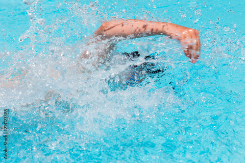 Swimmer in the open air swimming pool.
