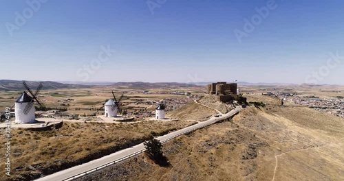 Old windmills and castle in Consuegra Toledo Spain