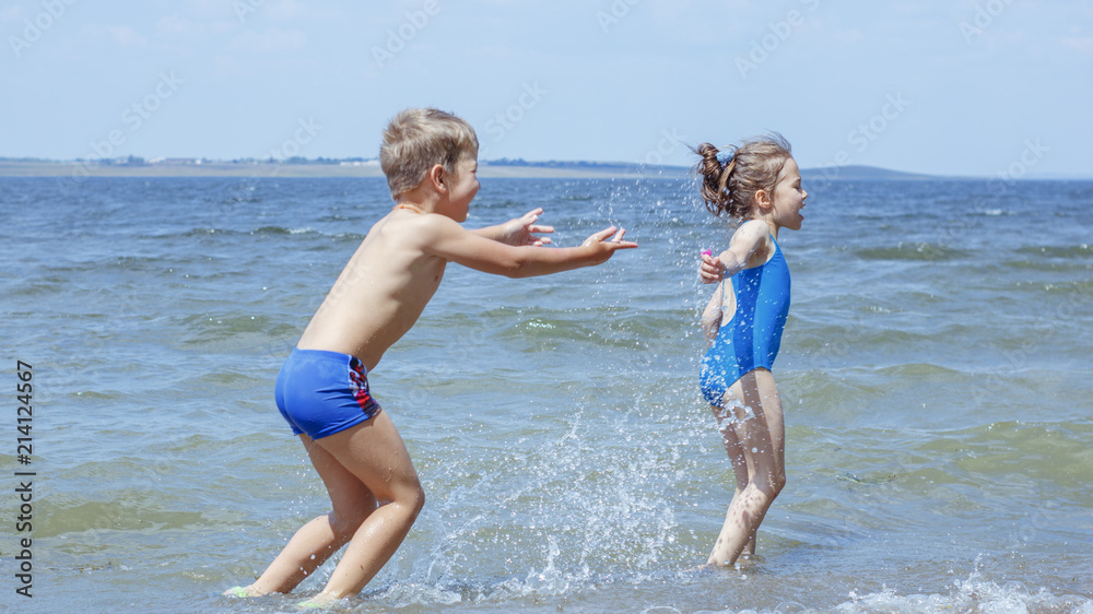 Children have fun playing on the seashore