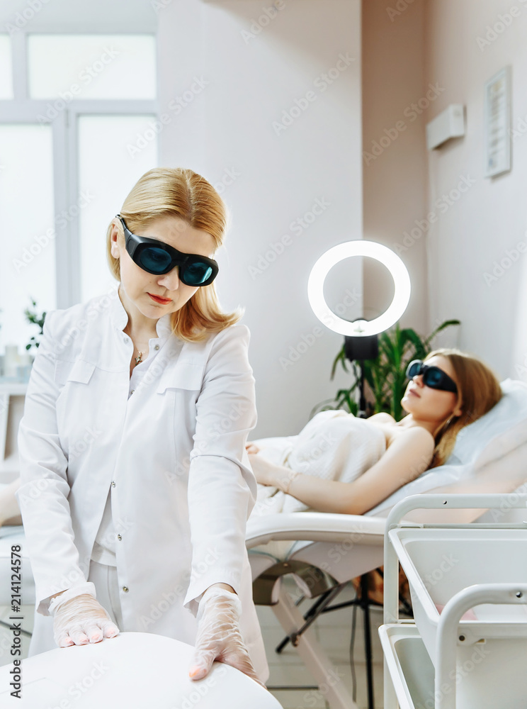 Laser epilation and cosmetology. Hair removal cosmetology procedure. Laser epilation and cosmetology. Cosmetology and SPA concept. Laser epilation and cosmetology. Hair removal cosmetology procedure. Laser epilation and cosmetology. Cosmetology and SPA concept.