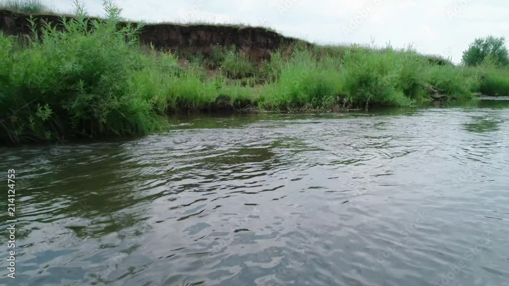 Clean river in nature. Movement of water in a small country river. Clean river in nature. Movement of water in a small country river.