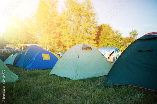 Fototapeta Naklejka Na Ścianę i Meble -  Camping in the clearing in the morning. Tents in the camping in the evening. recreation group of people