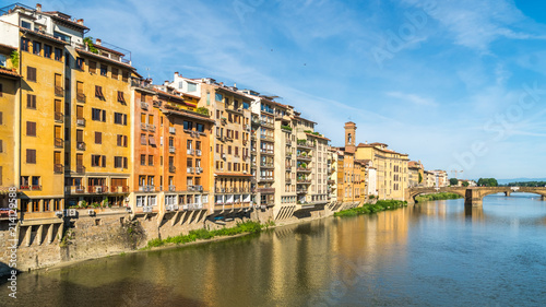 Colorful old buildings line the Arno River in Florence, Italy © k_samurkas