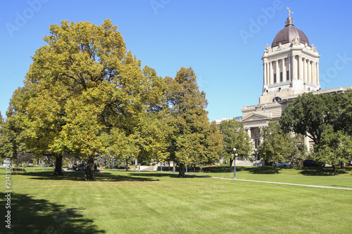 Winnipeg, Manitoba/Canada - September 17, 2016:  Beautiful green park with the Manitoba Legislative Building on the background.