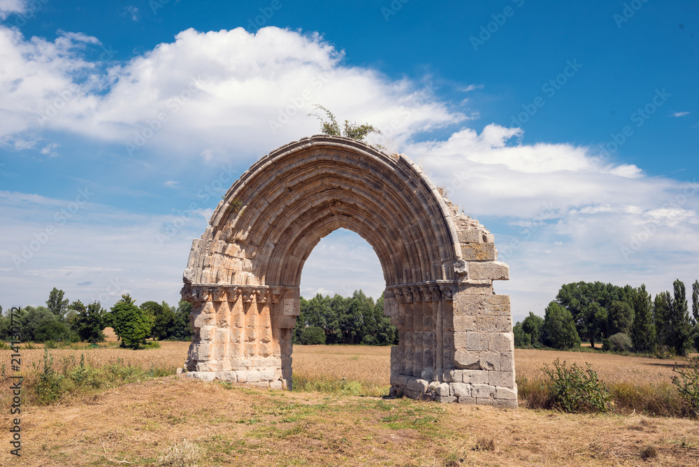 Ruined medieval arch of San Miguel de Mazarreros, in Olmillos de Sasamon. Burgos, Spain.