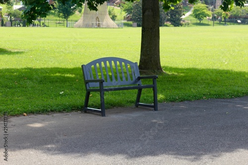The empty black park bench in the park. © Al