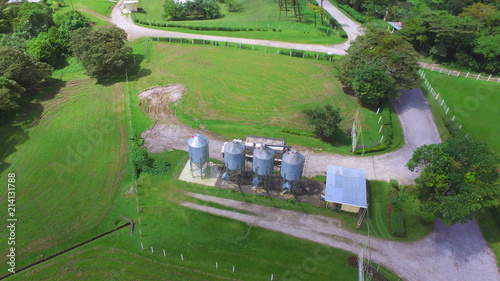 Aerial top view of feed bins inside a poultry farm