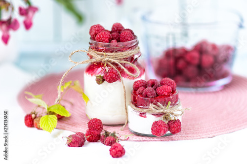 breakfasts, desserts. Yogurt with raspberry syrup and raspberry berries 