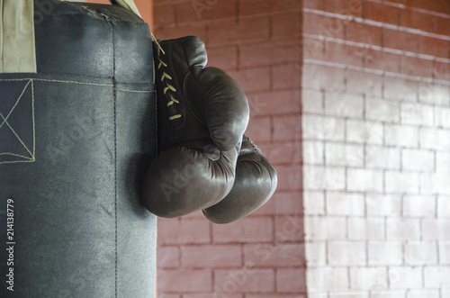 Boxing gloves on boxing bag © Ramilon Stockphoto