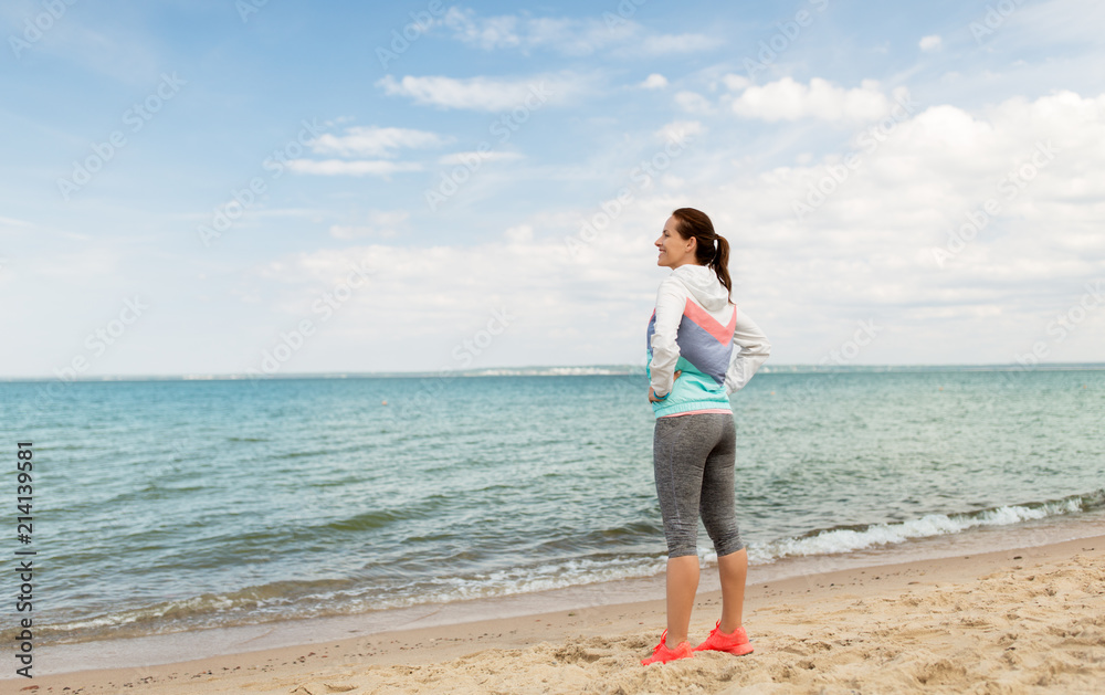 fitness, sport and healthy lifestyle concept - woman in sports clothes on beach fitness, sport and healthy lifestyle concept - woman in sports clothes on beach