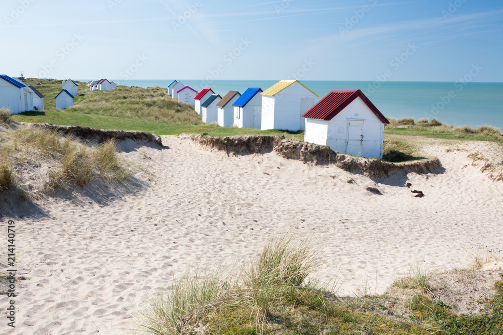 Obraz premium Colorful wooden beach cabins in the dunes, Gouville-sur-Mer, Normandy, France