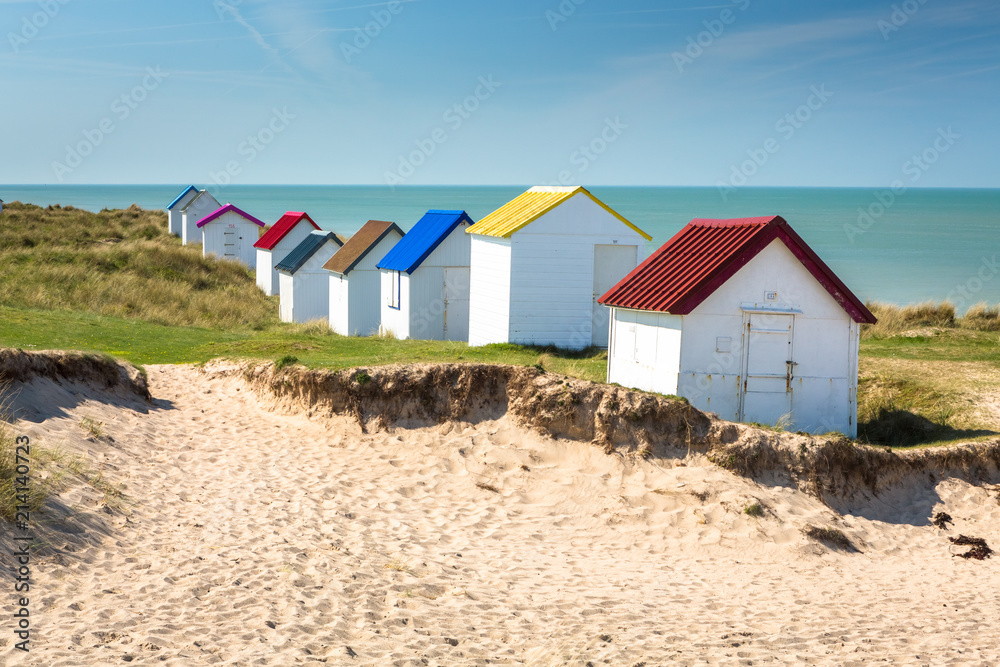 Obraz premium Colorful wooden beach cabins in the dunes, Gouville-sur-Mer, Normandy, France