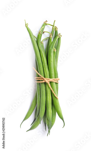 Tied fresh green French beans on white background