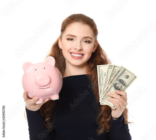 Young woman holding piggy b...