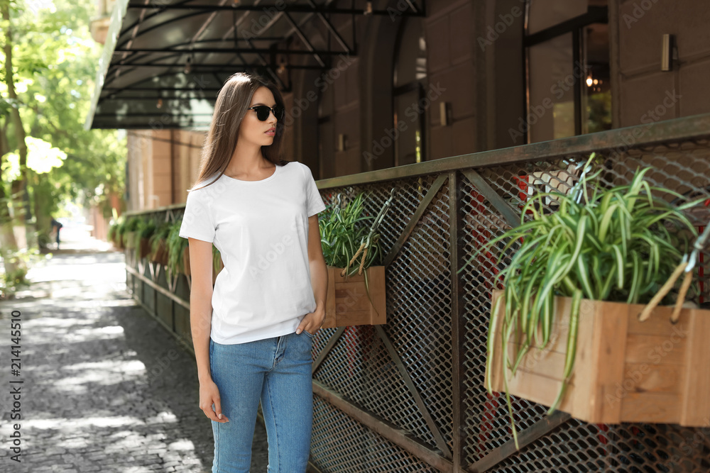Young woman wearing white t-shirt on street