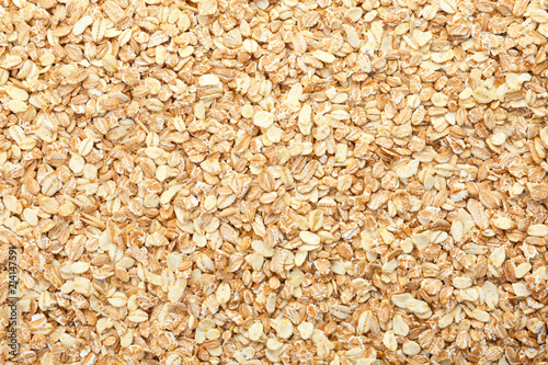 Raw oatmeal as background. Healthy grains and cereals