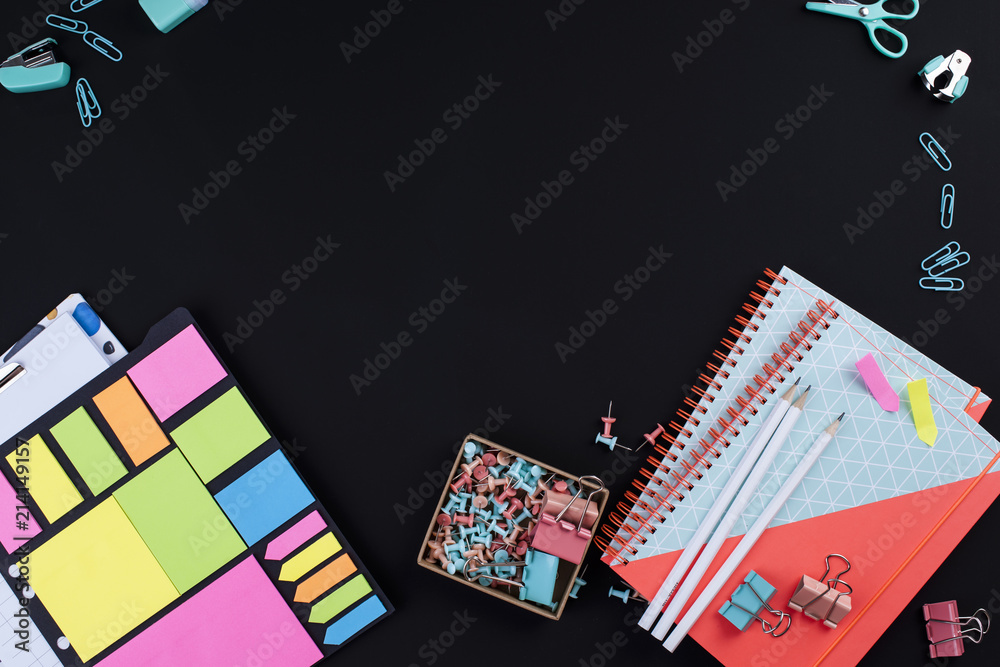 notebooks of pen for school on black background, place for text. copy space.